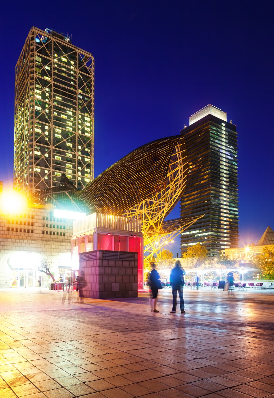 night view of skyscrapers in Port Olimpic - center of nightlife at Barcelona, Spain